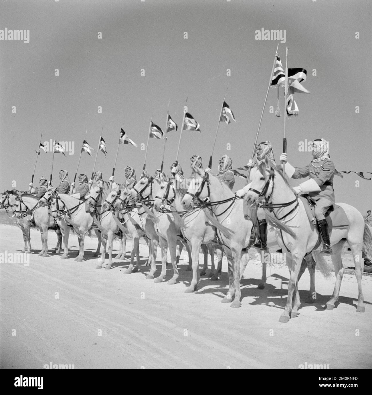 Willem van de Poll - Cavalry of the Royal Guard of Honor on horseback at a parade at Amman, Jordan - 1950 Stock Photo