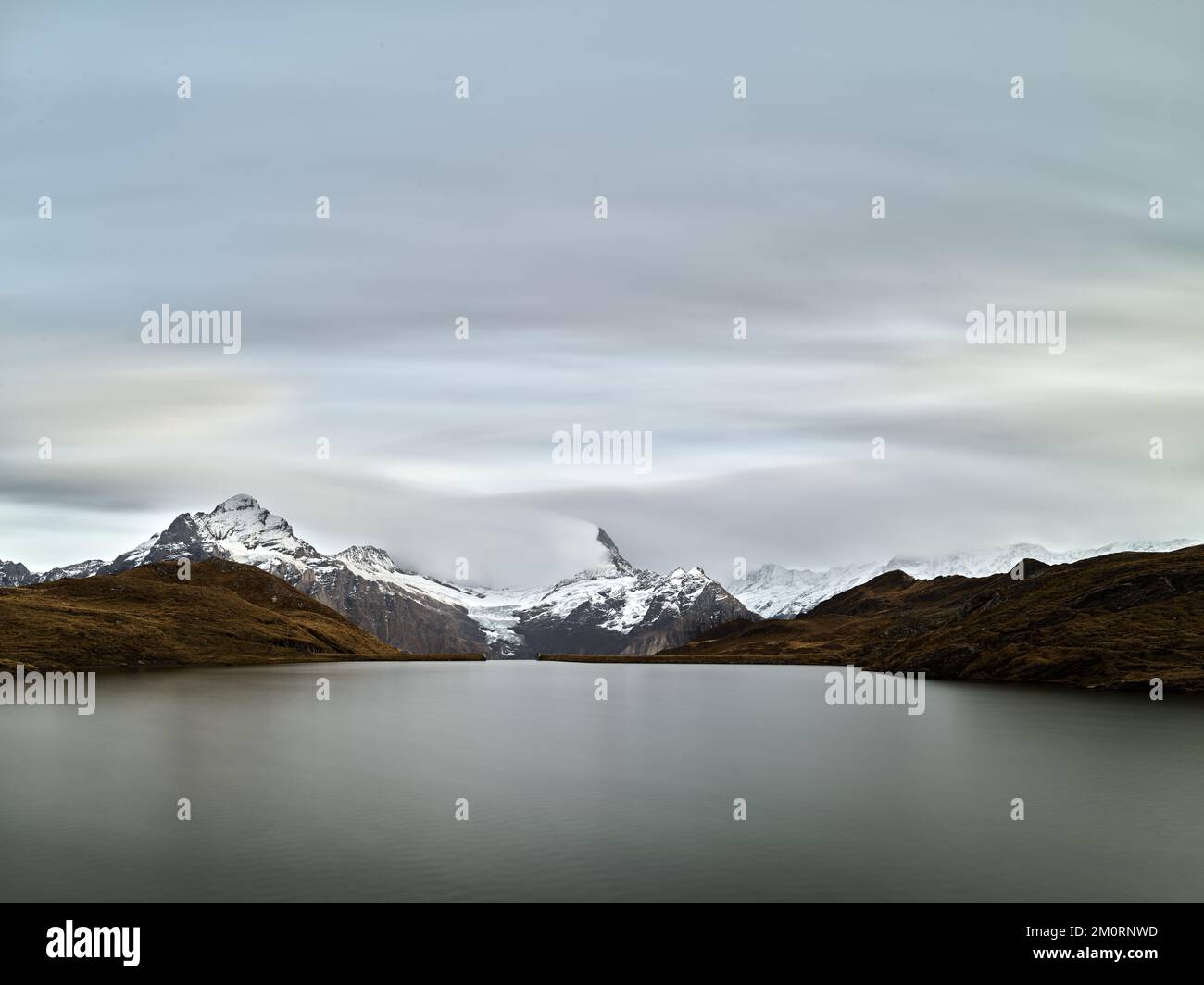 View across a lake of the Eiger, Grindelwald, Bern, Switzerland Stock Photo