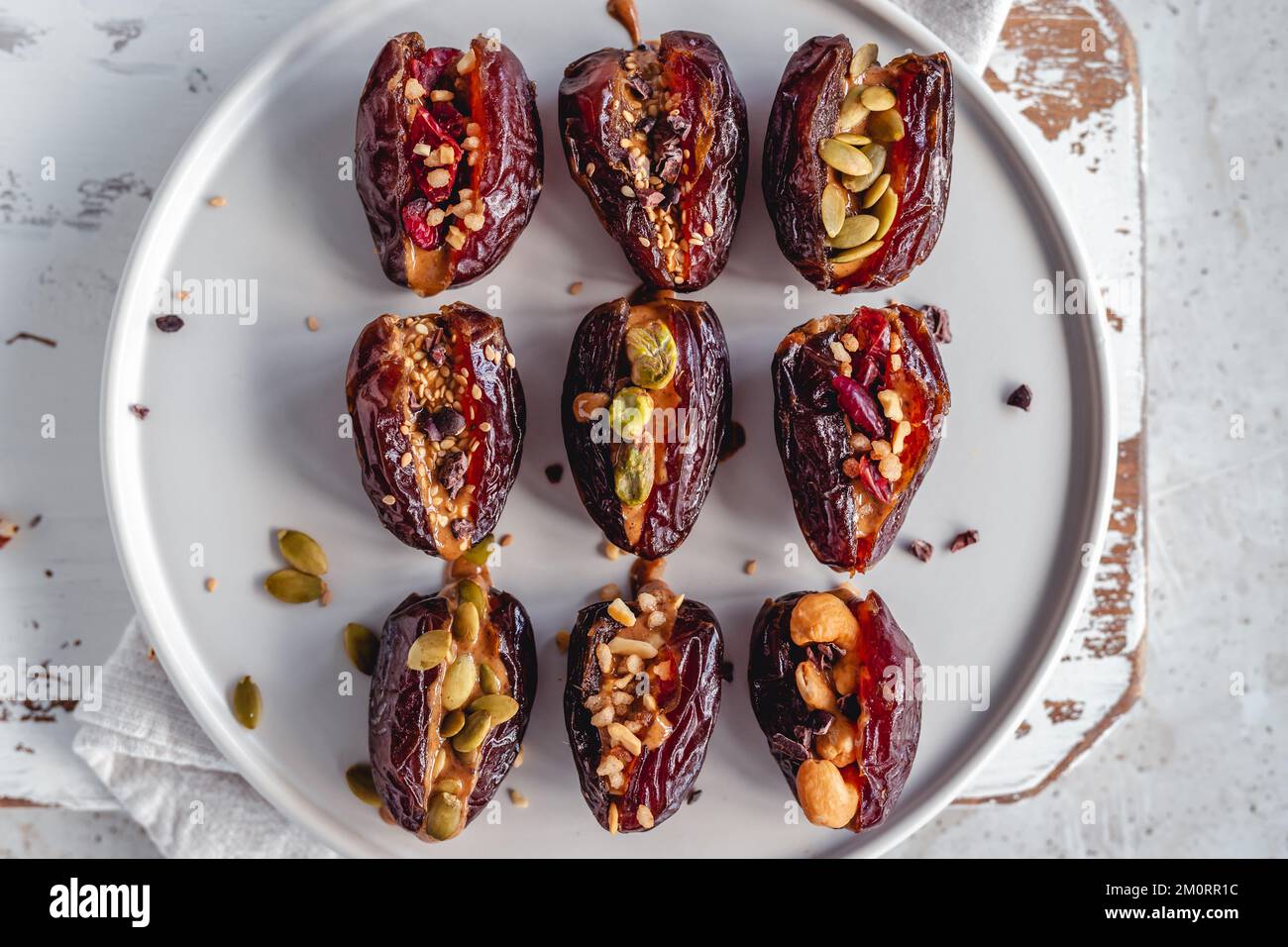 Overhead view of medjool dates stuffed with nut butter, dark chocolate