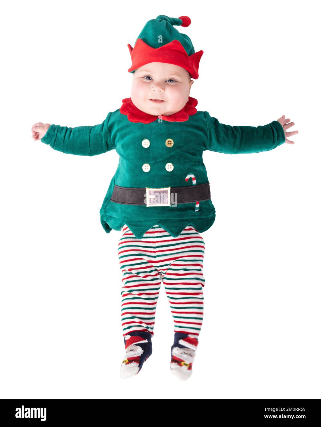 Baby wearing elf outfit babies first Christmas, isolated on white