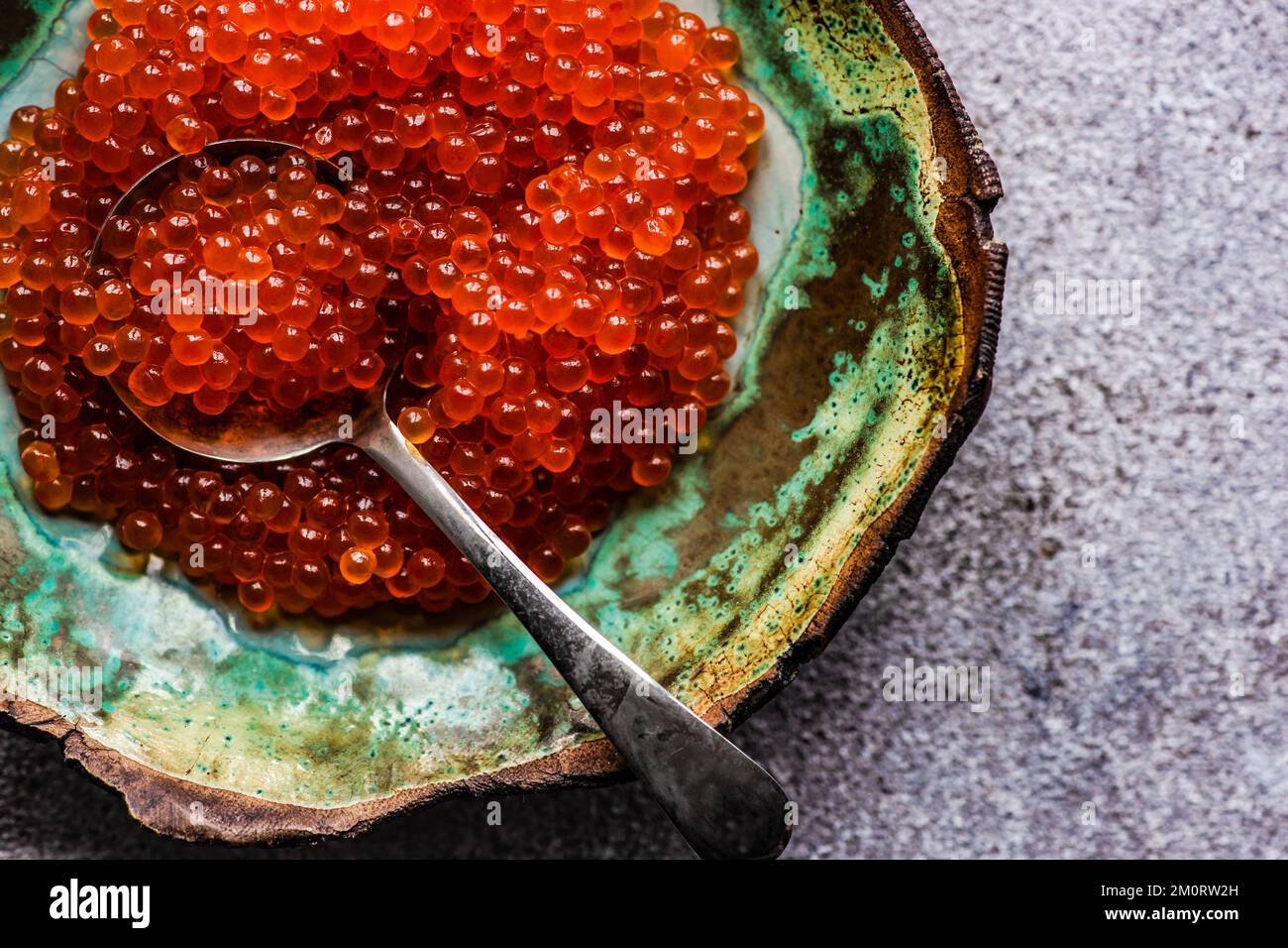 Close-up overhead view of a bowl of red trout caviar Stock Photo