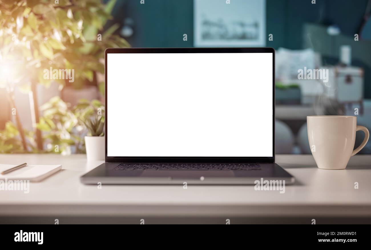 Blank screen laptop on desk Stock Photo