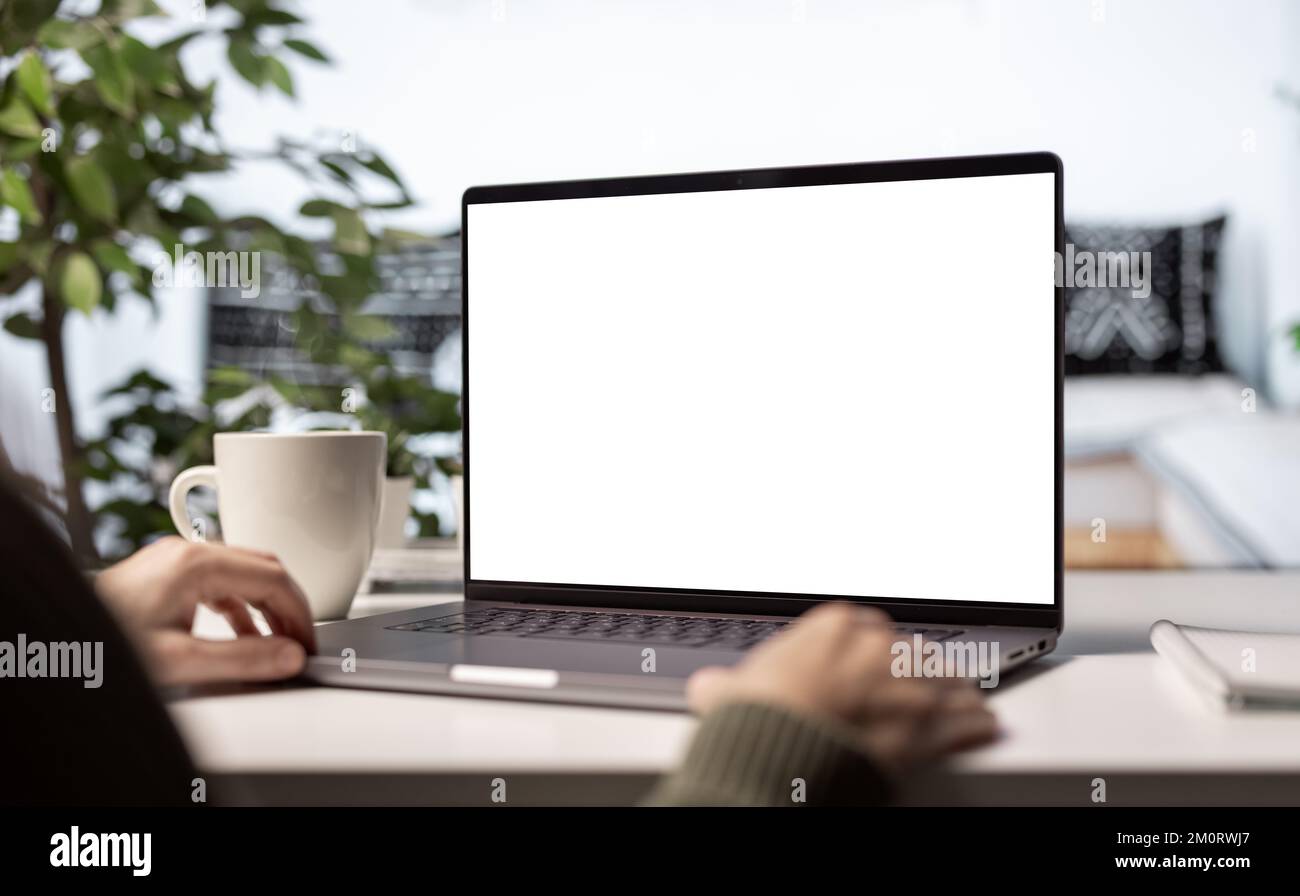 Blank screen laptop on desk Stock Photo
