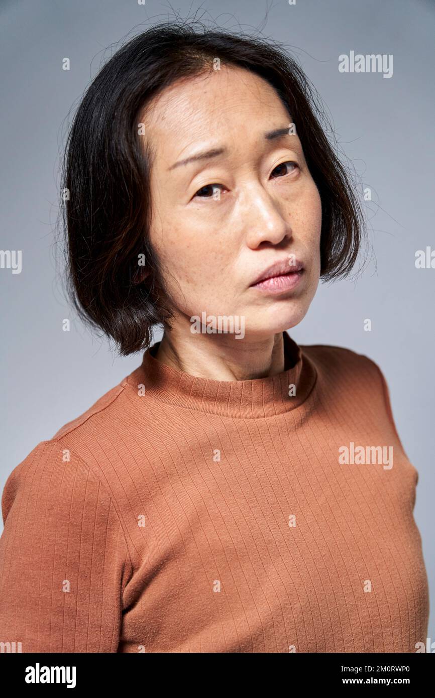 Mature asian woman hi-res stock photography and images - Alamy