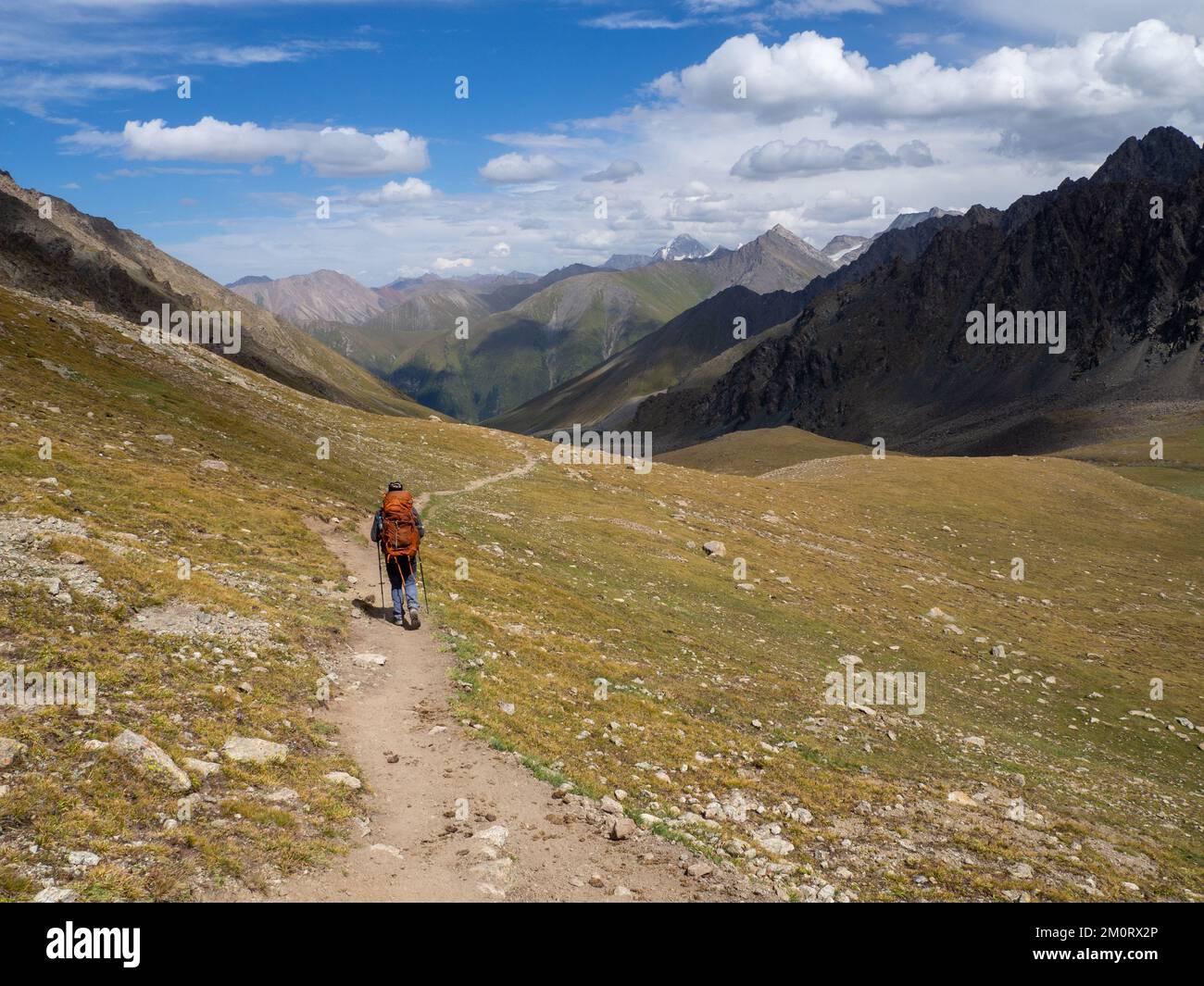 Person hiking in mountains hi-res stock photography and images - Alamy