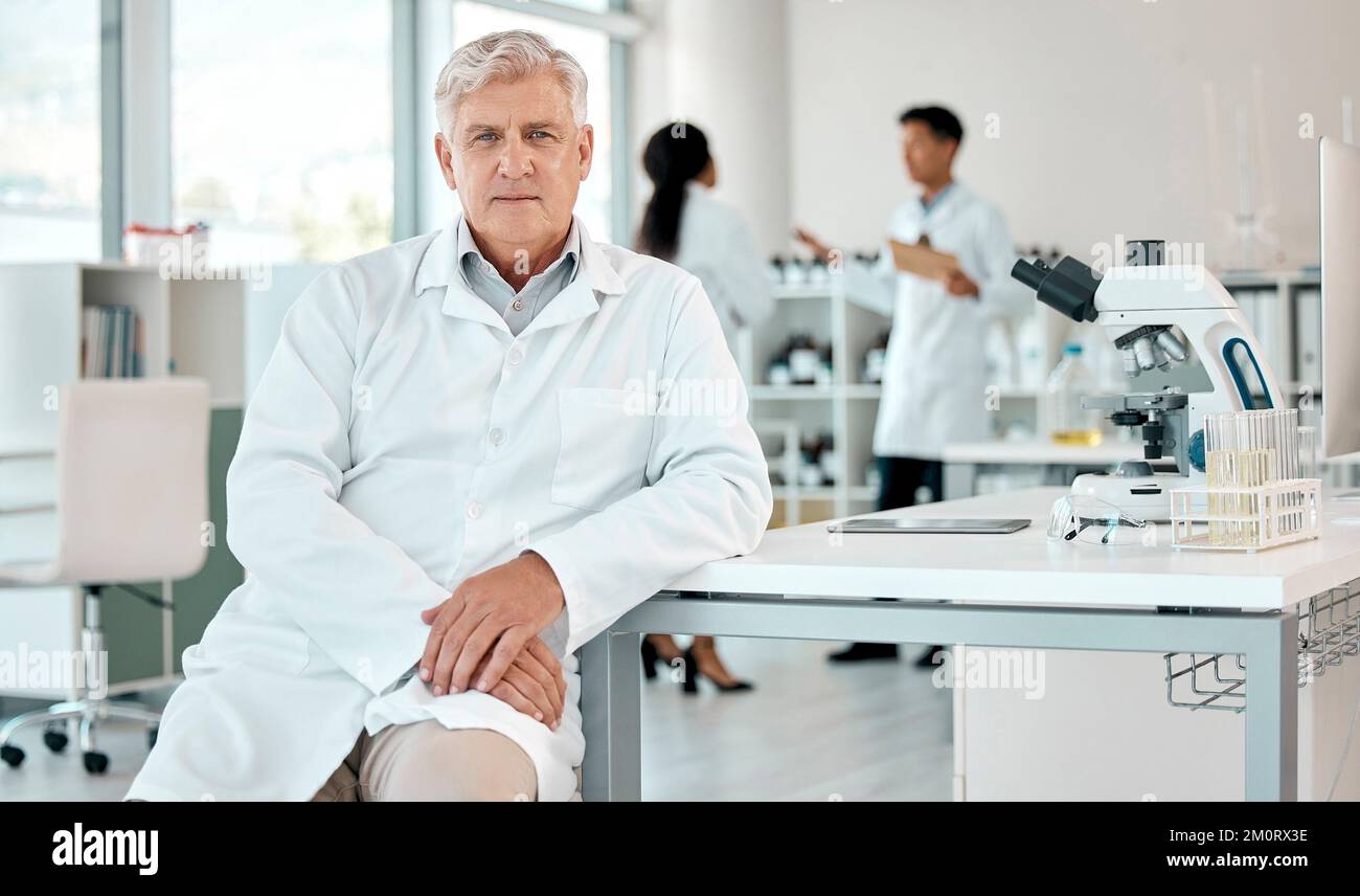 My schedule is filled with making discoveries. Portrait of a senior scientist working in a lab. Stock Photo