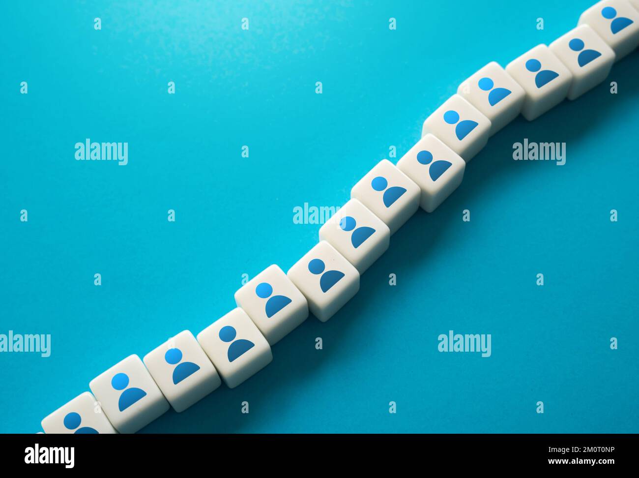 A chain of blocks with symbols of people. Human resources and work force. Staffing and recruiting candidates. Communication between employees. Buildin Stock Photo