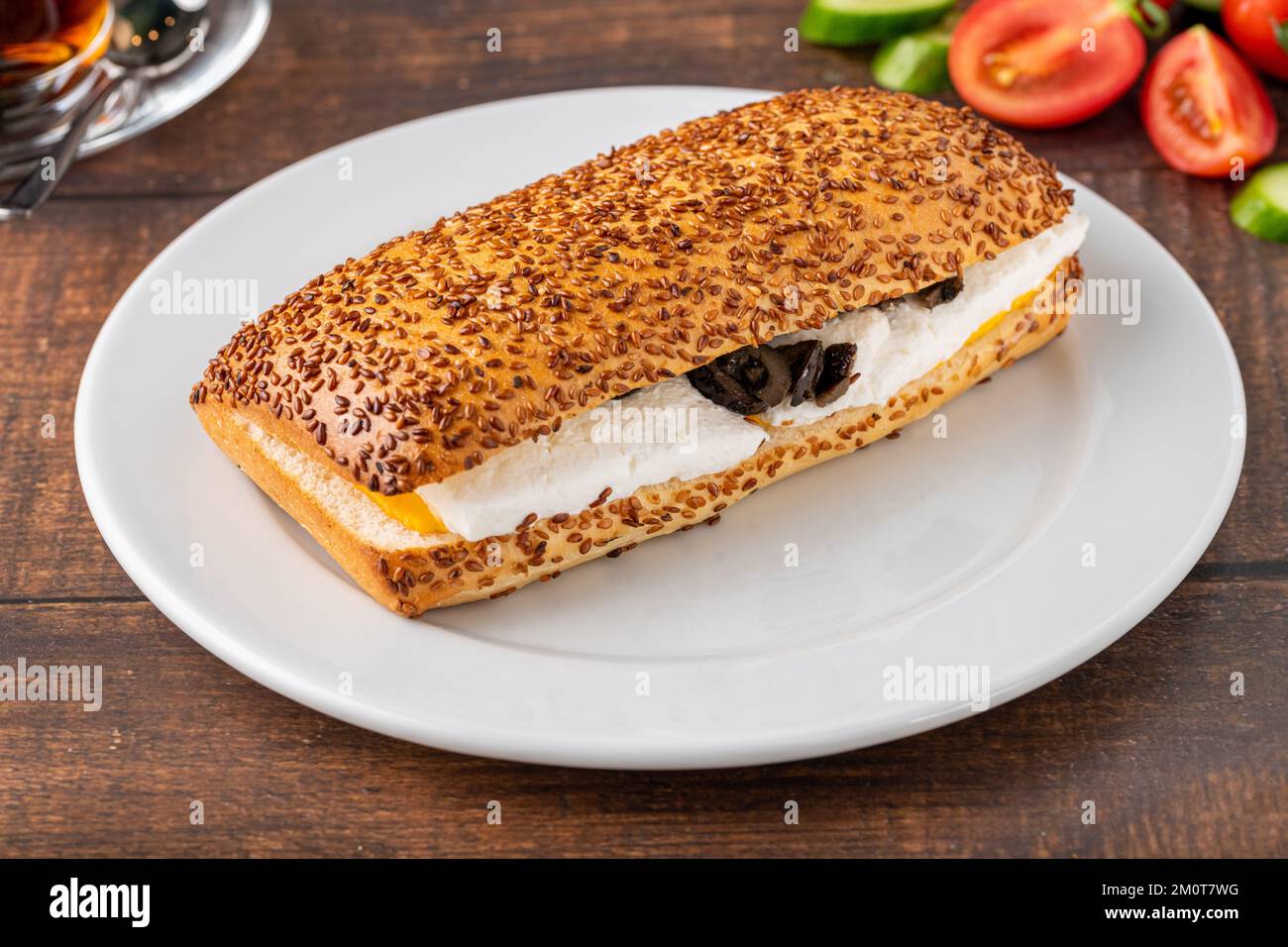Olive and cheese sandwich with Turkish tea on wooden table Stock Photo