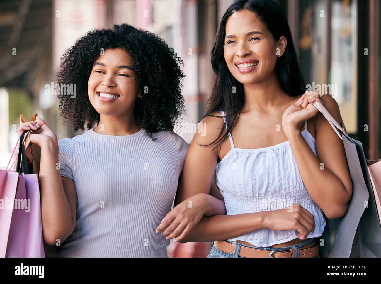 Shopping, friends and customer women with shopping bags in the city about retail sales and discount. Urban shopping mall, friendship and females happy Stock Photo
