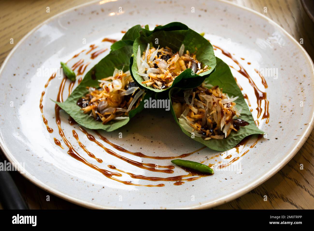 Traditional local cuisine thai fusion food Miang Kham or Savoury Leaf Wraps with dried fish and