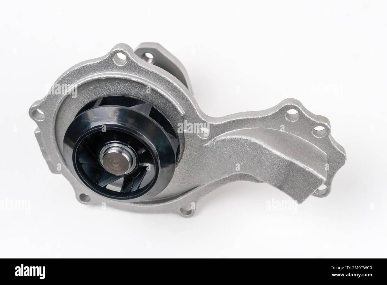 Closeup of a new spare part for a car water pump on a white background