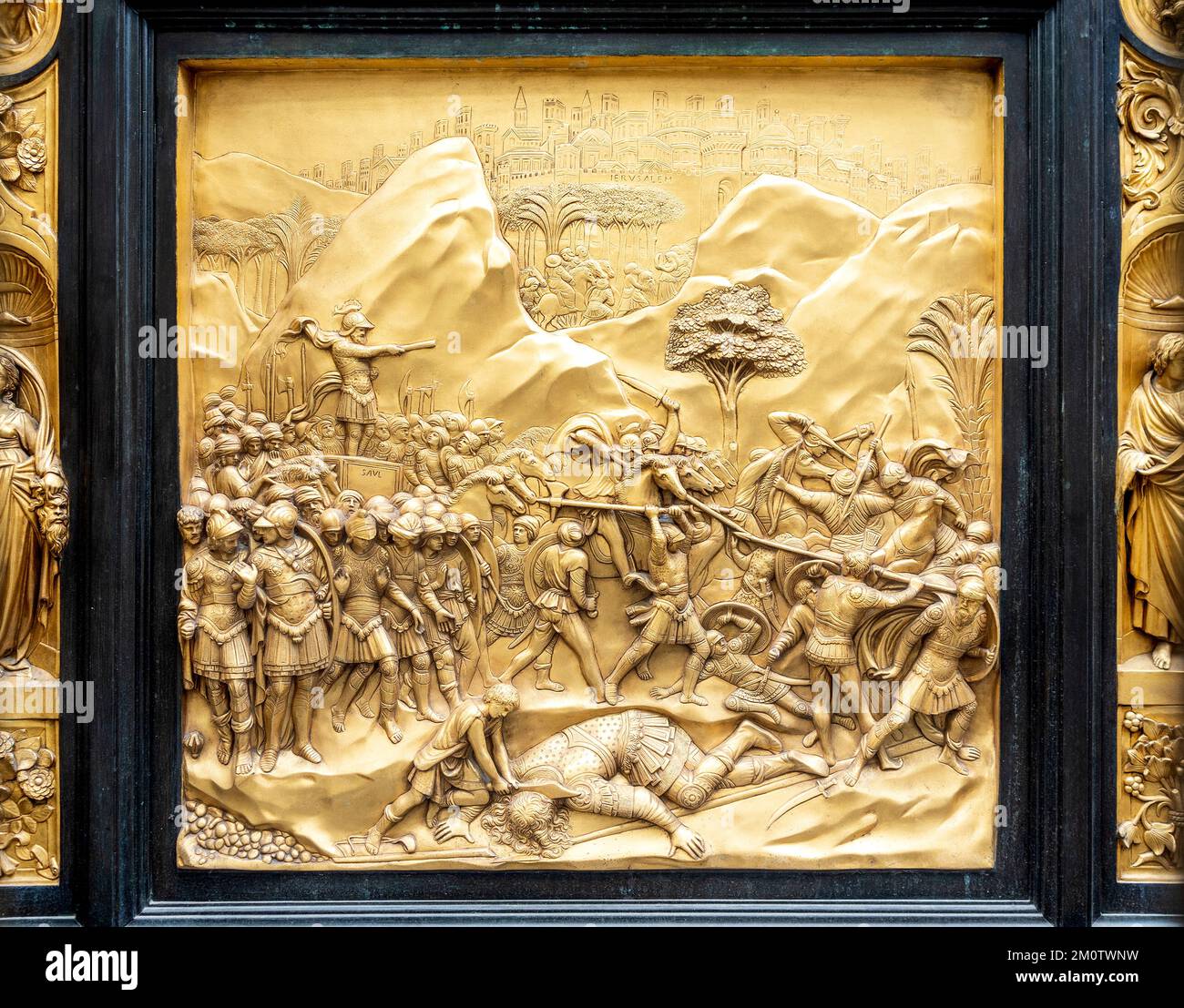 Panel of David's history in the Gates of Paradise, by Lorenzo Ghiberti, door of the Baptistry, Florence city center, Tuscany region, Italy Stock Photo