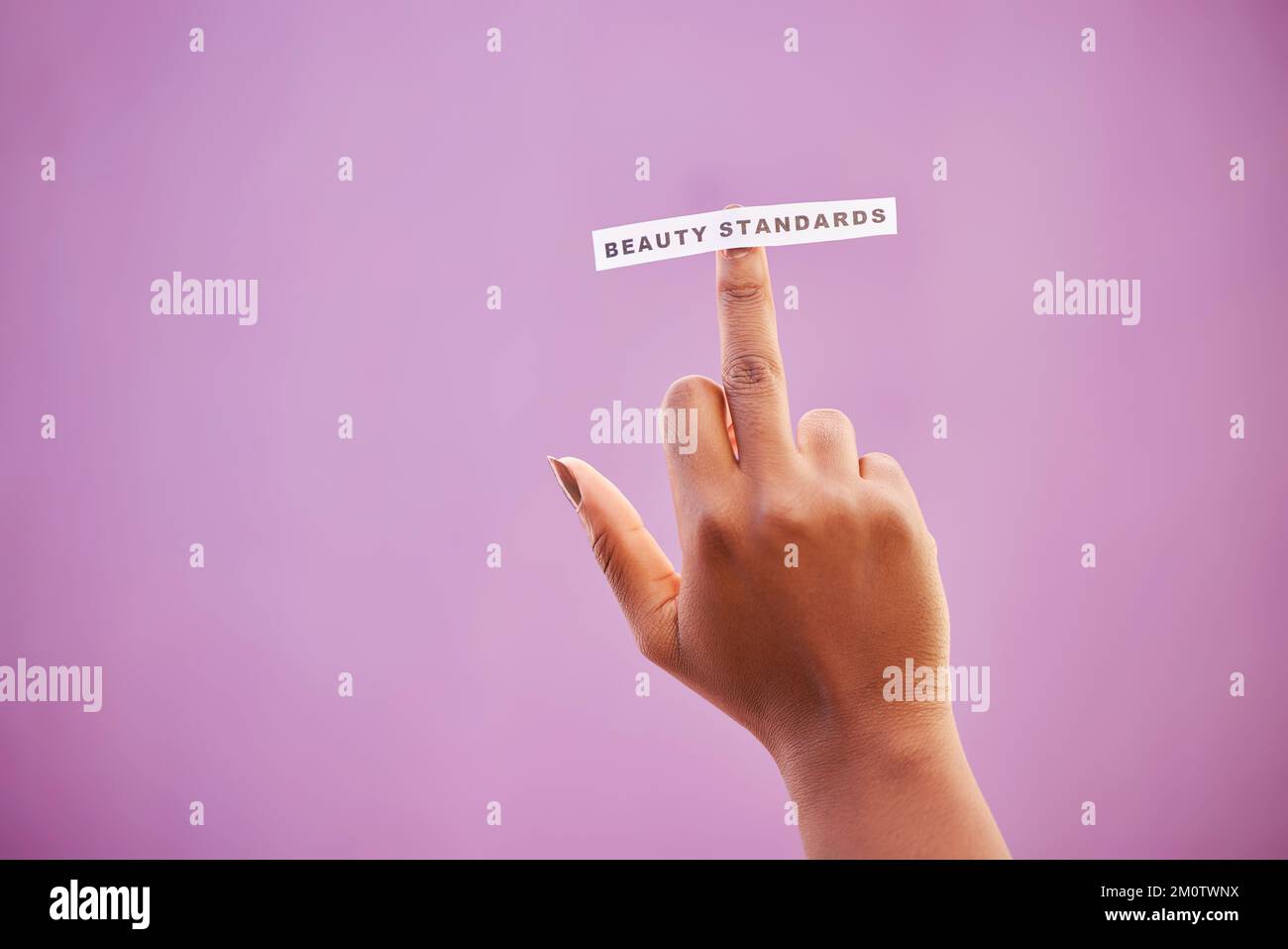 Woman, middle finger and beauty standards on studio background to ...