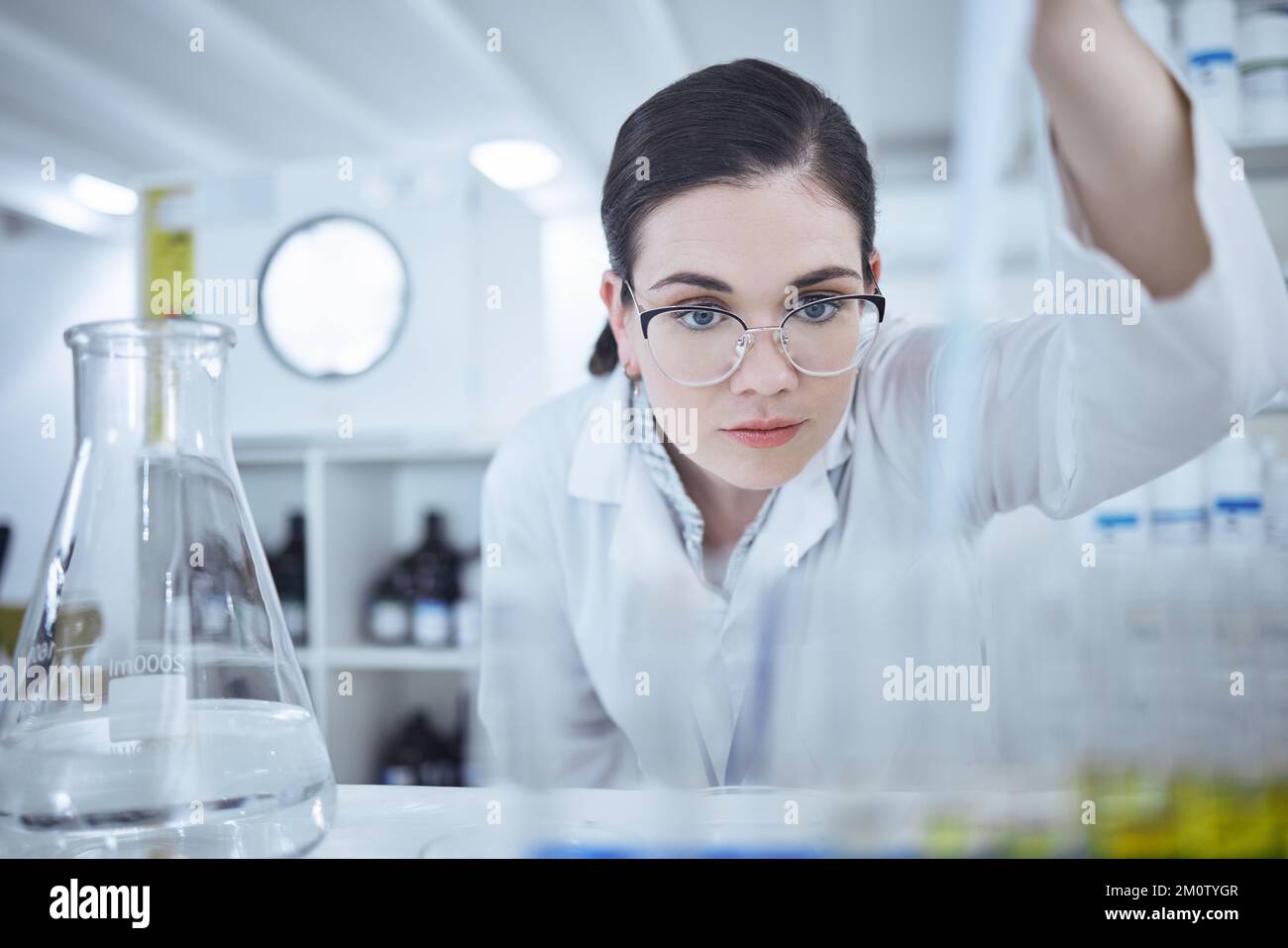 Searching for something new. a young female scientist testing samples. Stock Photo