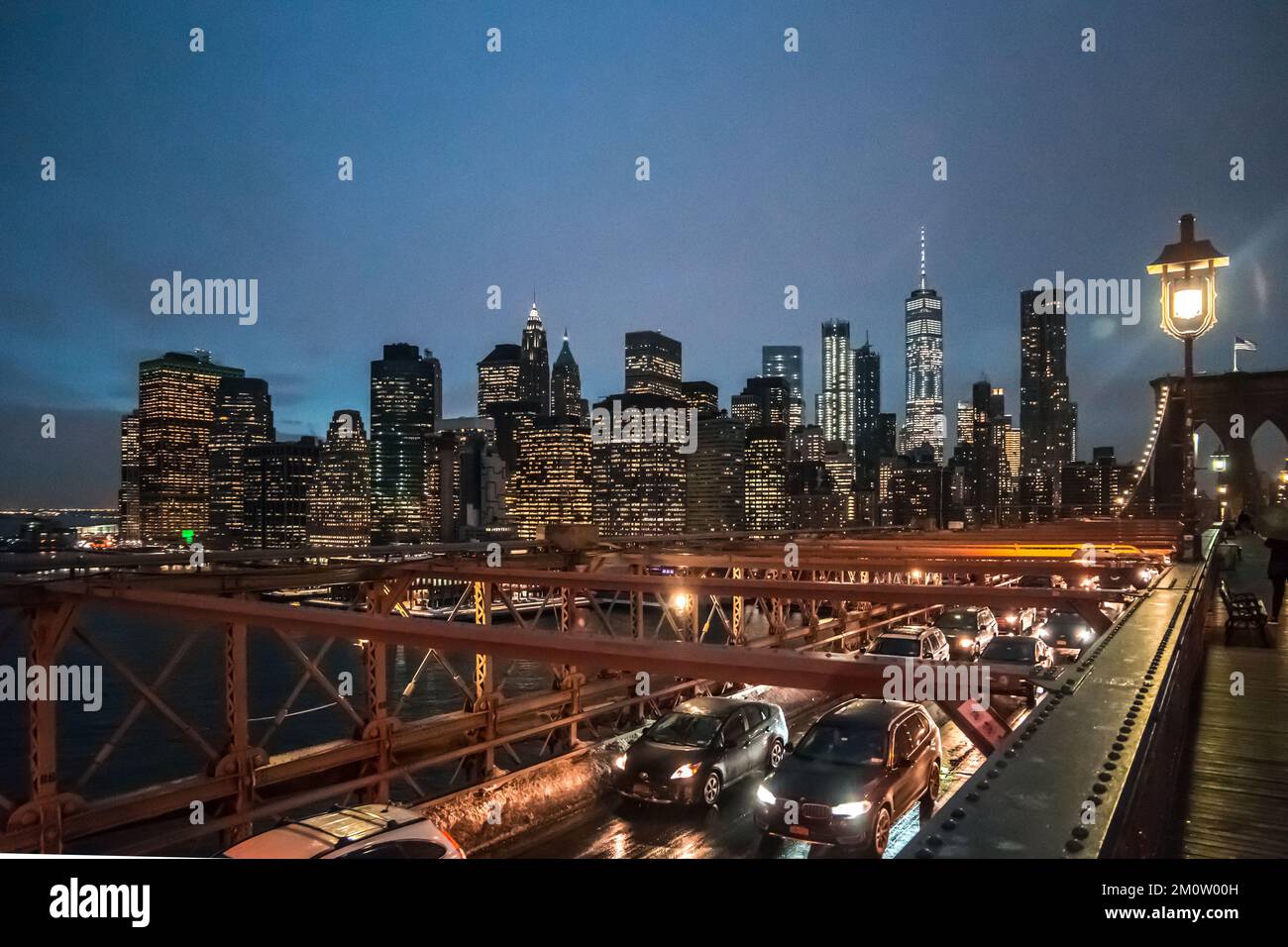 view on NYC from brooklyn bridge at night Stock Photo