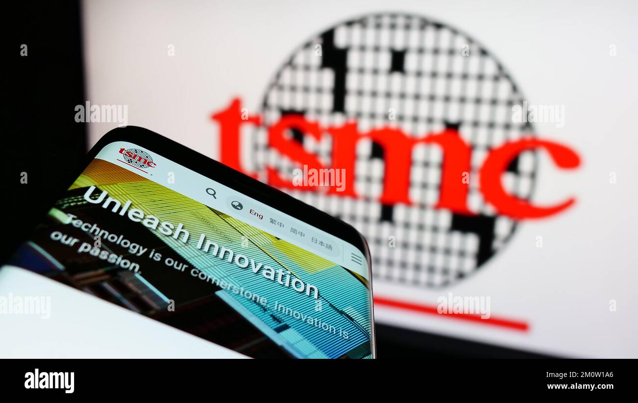 Smartphone with webpage of company Taiwan Semiconductor Manufacturing Company (TSMC) on screen
