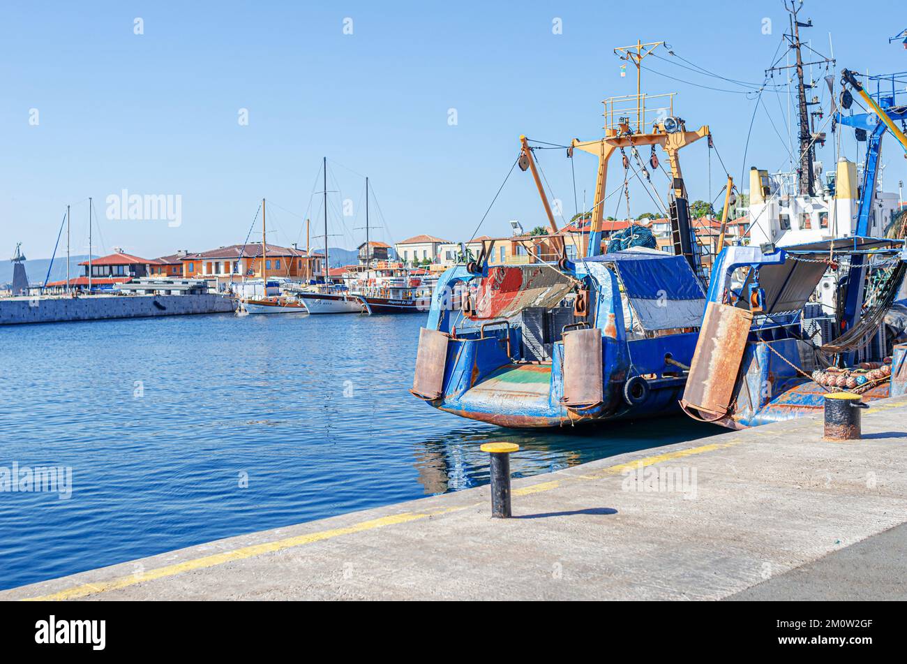 Fishing boats in the bay against the background of the old town of Nessebar, Bulgaria. Stock Photo