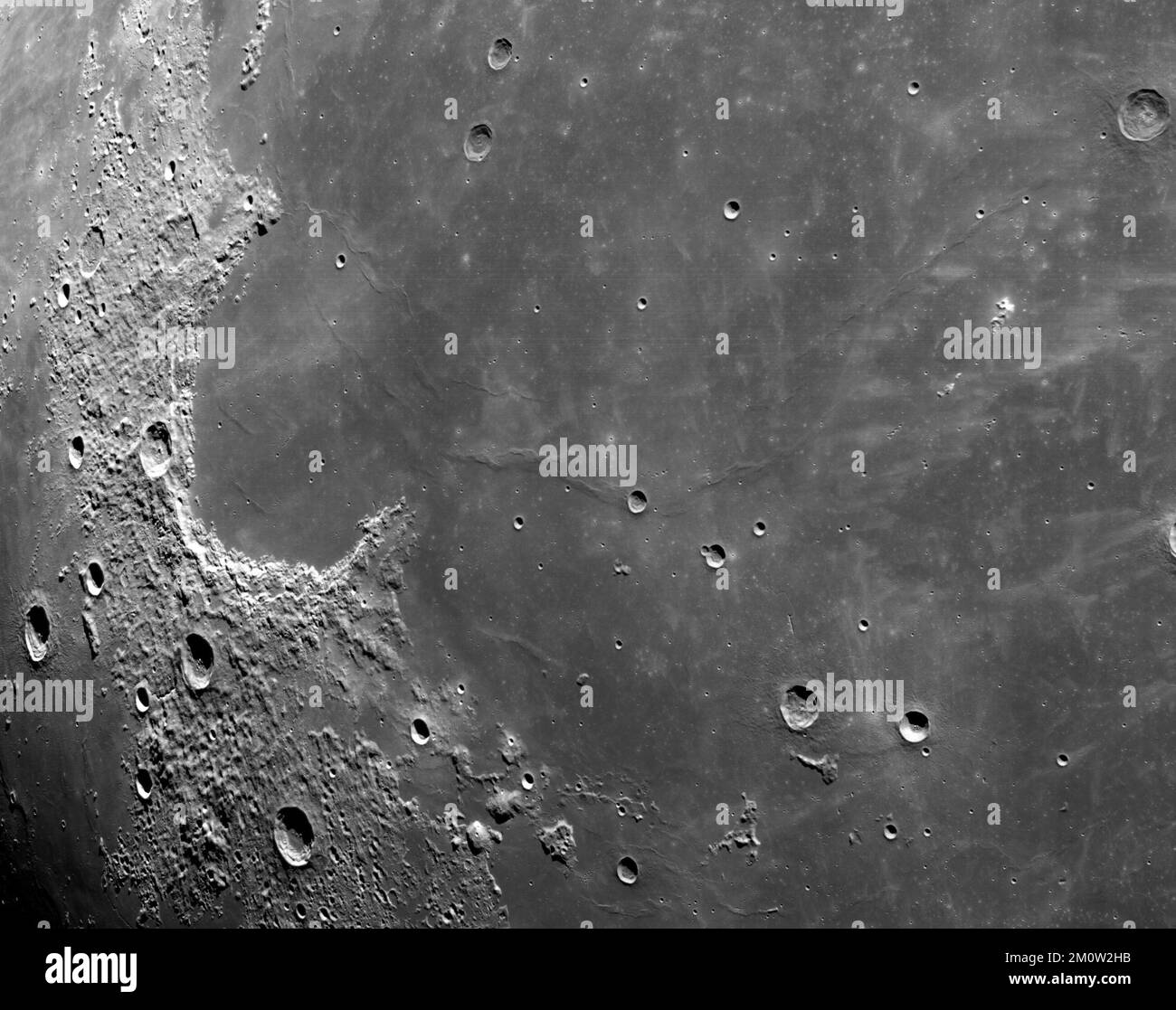 EARTH, THE MOON - 05 December 2022 - Cameras mounted on the crew module of the Orion spacecraft captured these views of the Moon’s surface. On flight Stock Photo