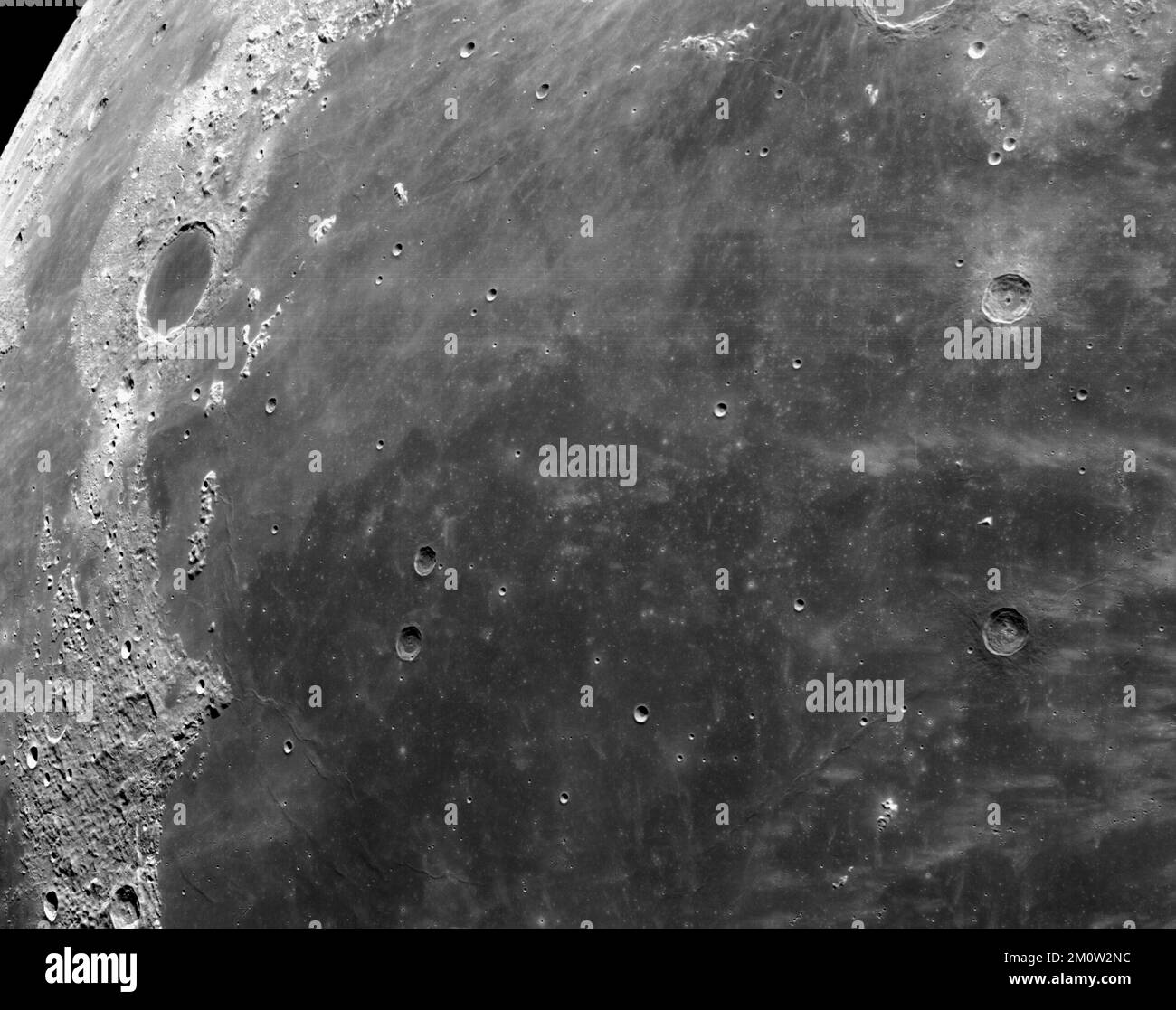 EARTH, THE MOON - 05 December 2022 - Cameras mounted on the crew module of the Orion spacecraft captured these views of the Moon’s surface. On flight Stock Photo