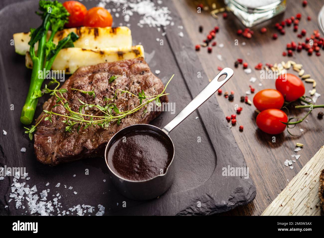 Black Angus New York steak. Marbled beef sirloin from Uruguay. Delicious healthy traditional food closeup served for lunch in modern gourmet cuisine r Stock Photo