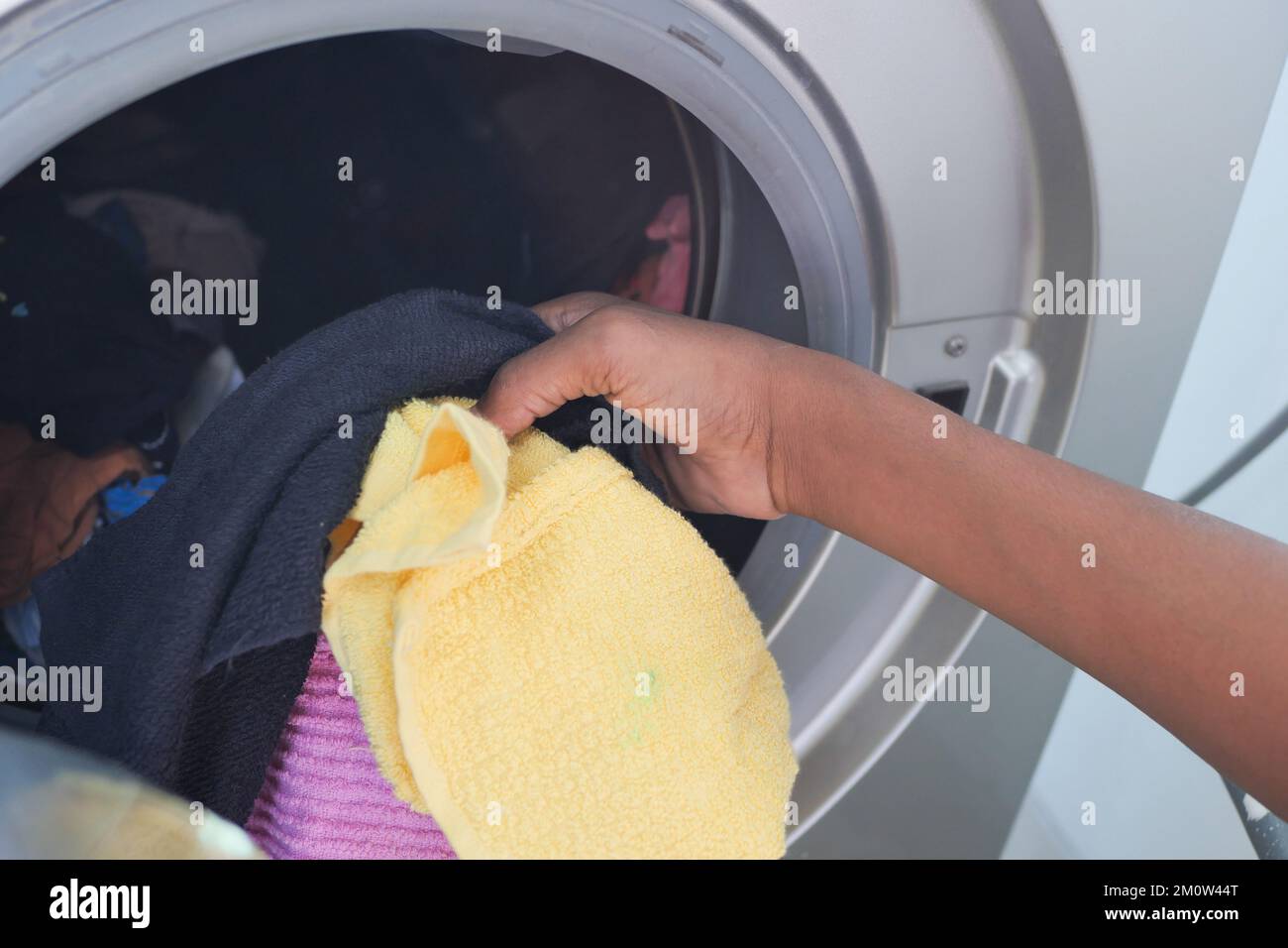 close up of cloths in a washing machine. Stock Photo