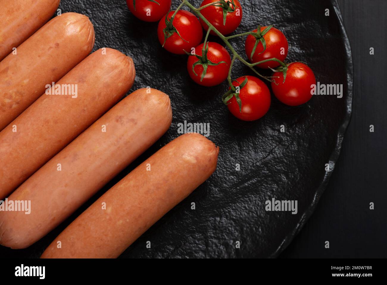 Fresh raw minced meat and cuts of beef, minced meat with herbs and