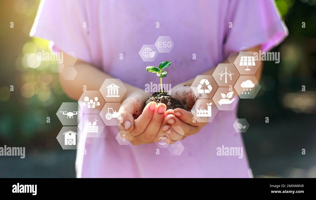 Cute kid planting a tree for help to prevent global warming or climate