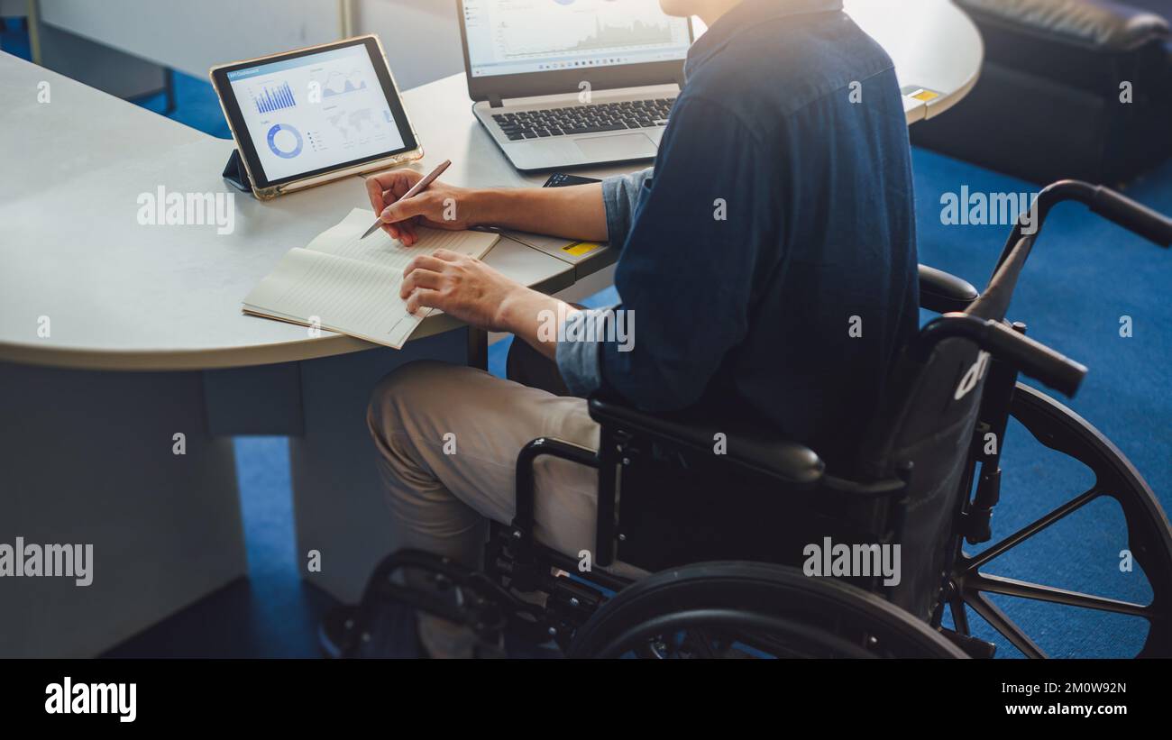 After accident and rehabilitation, disabled man on wheelchair can