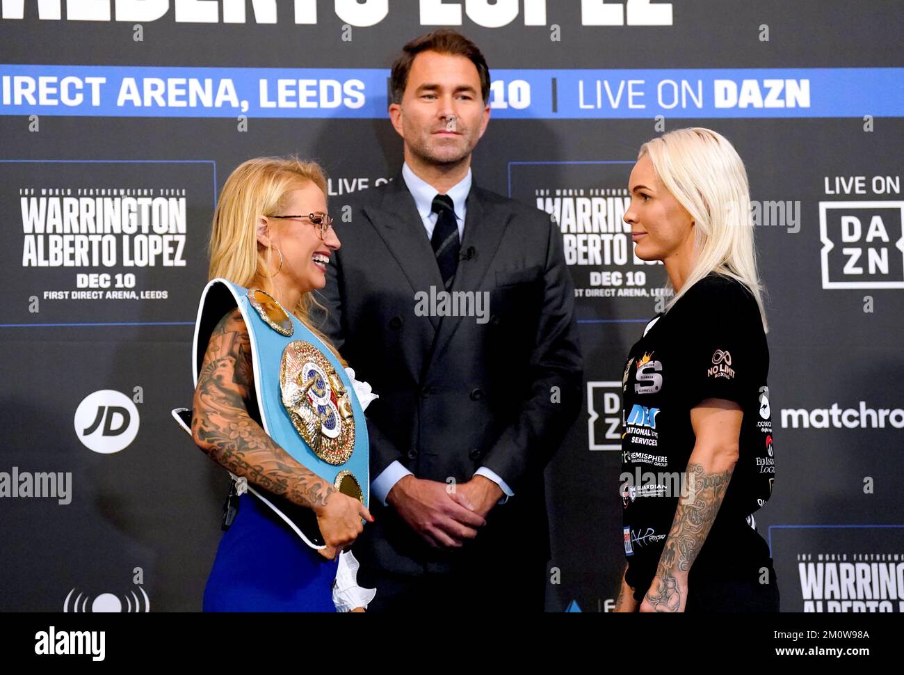 Boxing promoter Eddie Hearn looks on as Ebanie Bridges (left) and Shannon O'Connell face off during a press conference at Aspire, Leeds. Picture date: Thursday December 8, 2022. Stock Photo