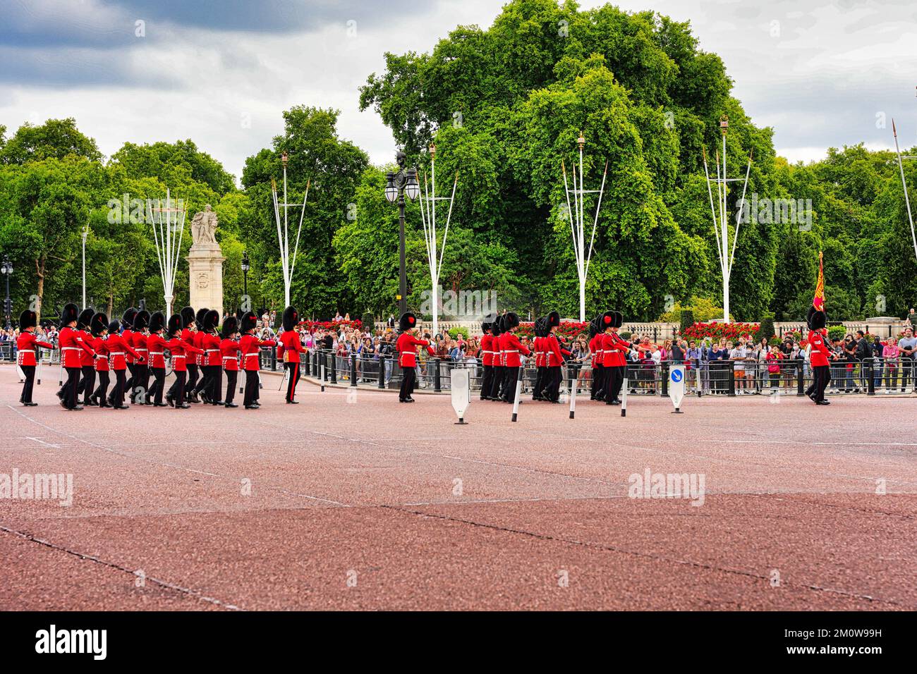 The guards wearing red coats & bearskin hats perform a traditional