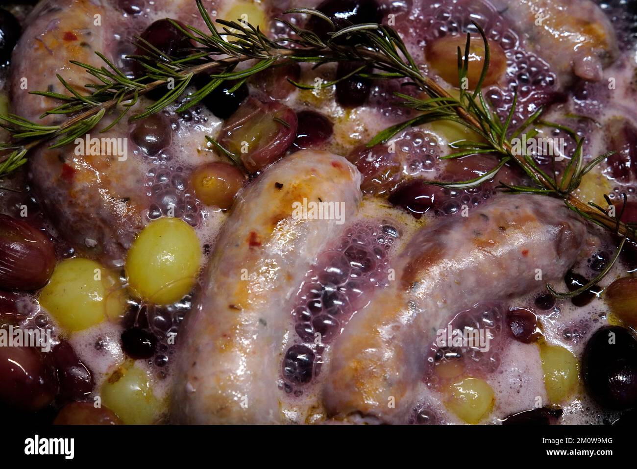 Salsiccia with grapes, dish from southern Italy Stock Photo