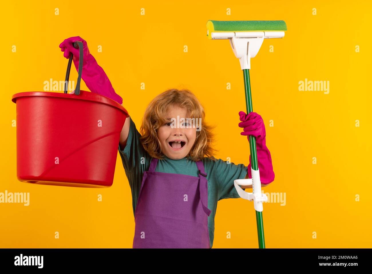 Child mopping house, cleaning home. Detergents and cleaning accessories.  Cleaning service. Little boy housekeeping Stock Photo - Alamy