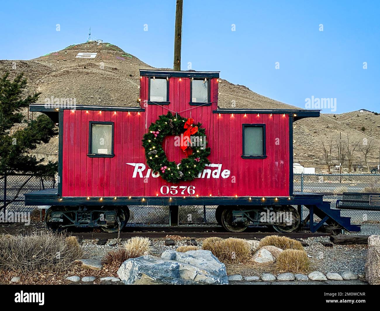Caboose #0576 sits in Salida, Colorado  decorated with a Christmas wreath in the winter. Stock Photo