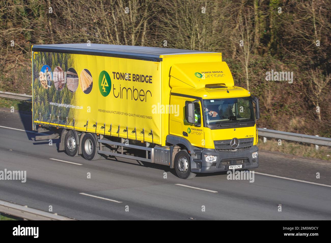 TONGE BRIDGE TIMBER lorry, Premier manufacturer of high quality machined timber Mercedes Atros travelling on the M61 motorway UK Stock Photo