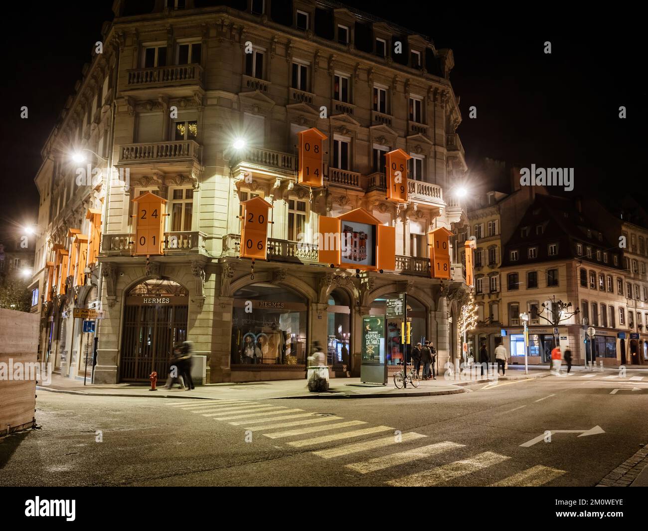 Strasbourg, France - Nov 25, 2022: New luxury hermes flagship store in Place Broglie in central Strasbourg with lights being dimmed due to lack of power electricity Stock Photo