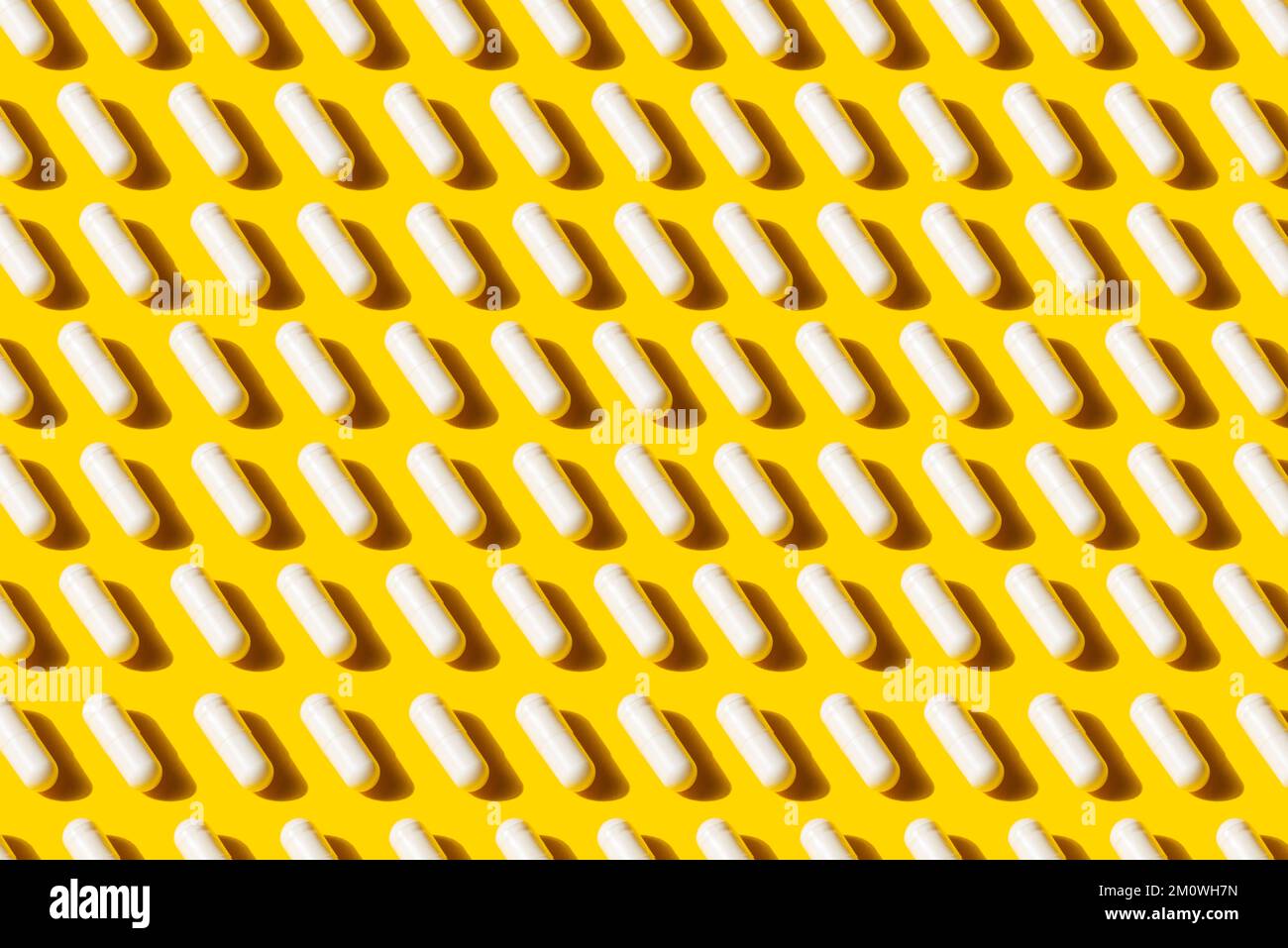 Pattern White Pill Capsule Isolated On Yellow Background, The concept