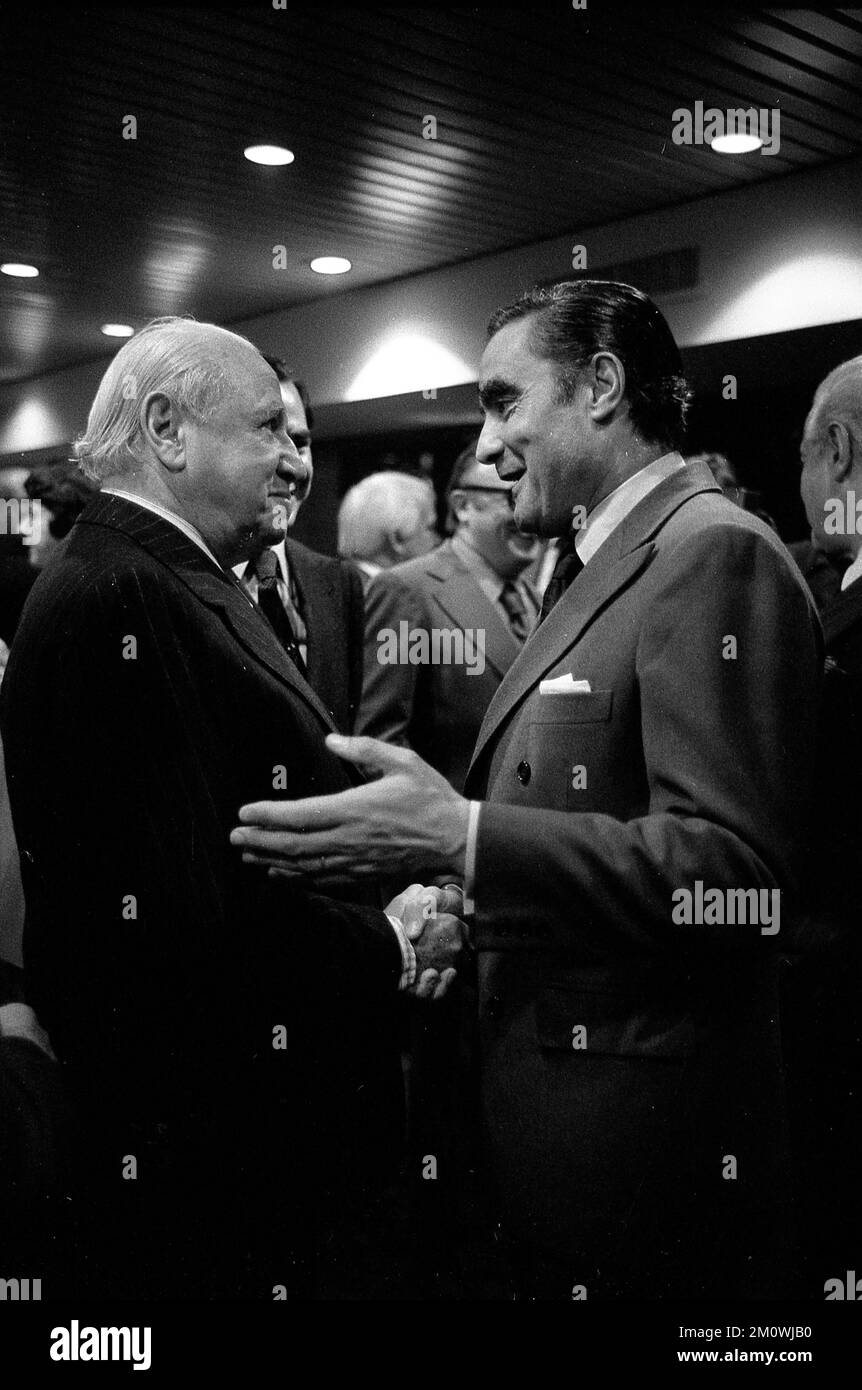 Argentine Navy Commander Eduardo Emilio Massera (right) greets