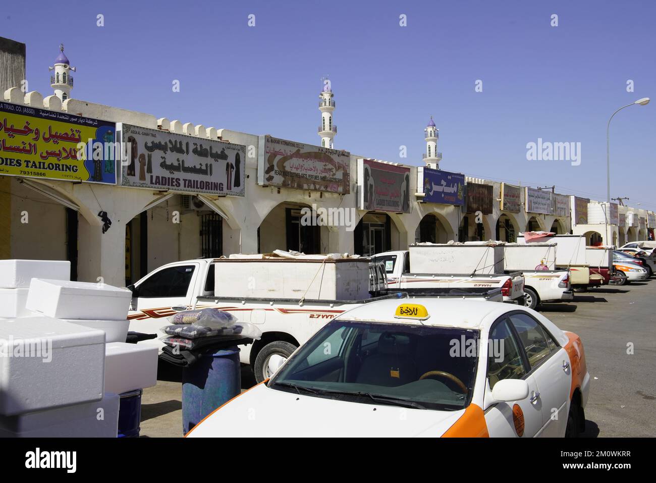Tailor shops by market square in small town in Hajar region, Sultanate of Oman. Stock Photo