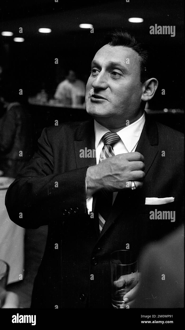 Richard Tucker, American tenor, during a press interview in Buenos