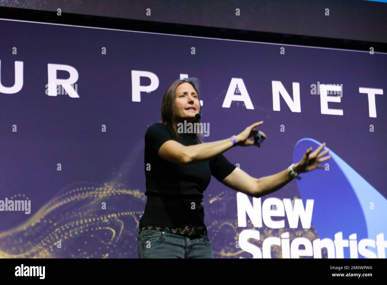 Helen Czerski giving a talk entitled 'Physicist in the wild' on the Our Planet Stage, during the dedicated School's Day, at New Scientist Live 2022 Stock Photo
