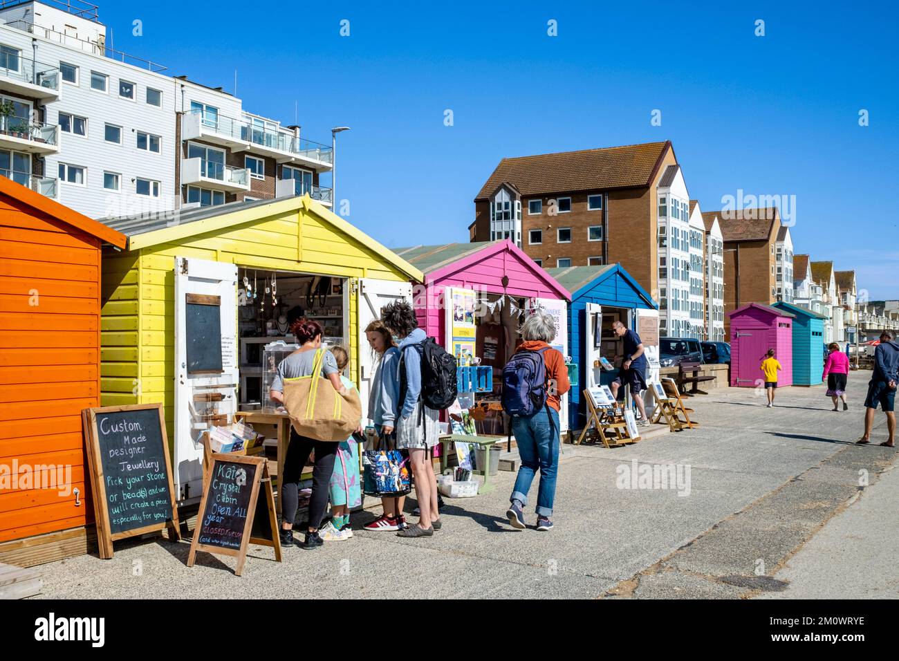 Colourful Beach Huts That Have Been Converted Into Shops, Seaford, East Sussex, UK Stock Photo