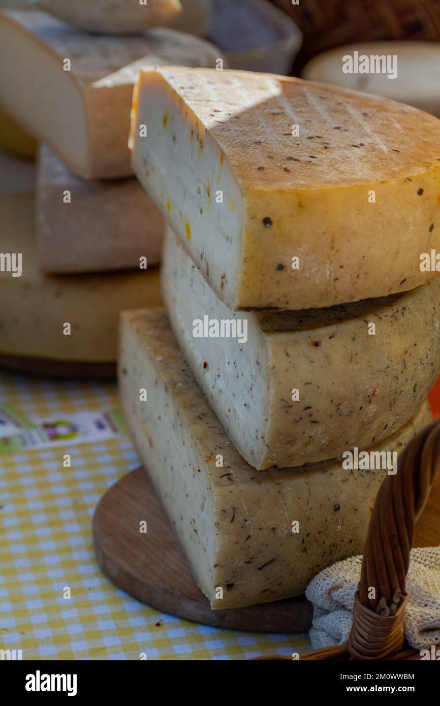 Craft cheese from cows milk. Cheese head. Selective focus Stock Photo