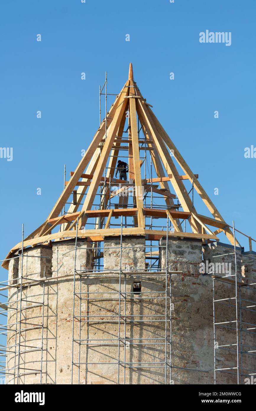 Repair of the towers of the fortress. Tighina Fortress Maintenance. Scaffolding on the tower of the fortress. Repair of the fortress under patronage U Stock Photo