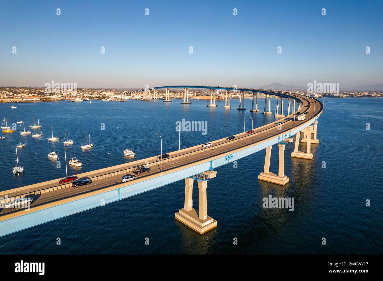 Aerial view of Coronado Bridge in San Diego bay in southern California on a warm sunny day with boats in the bay and cars crossing the bridge Stock Photo
