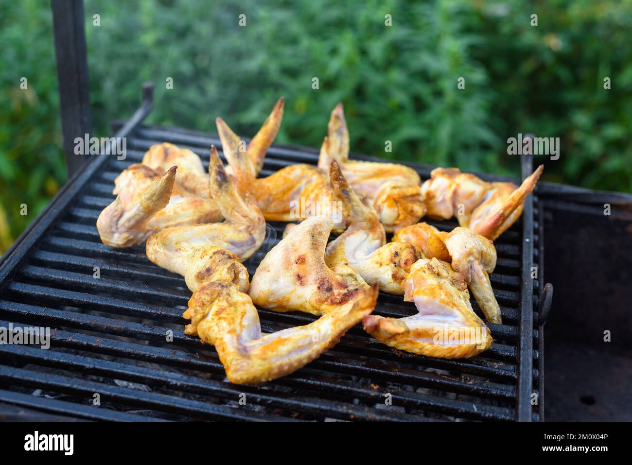 Grilled chicken wings on a barbecue grill in the yard Stock Photo Alamy