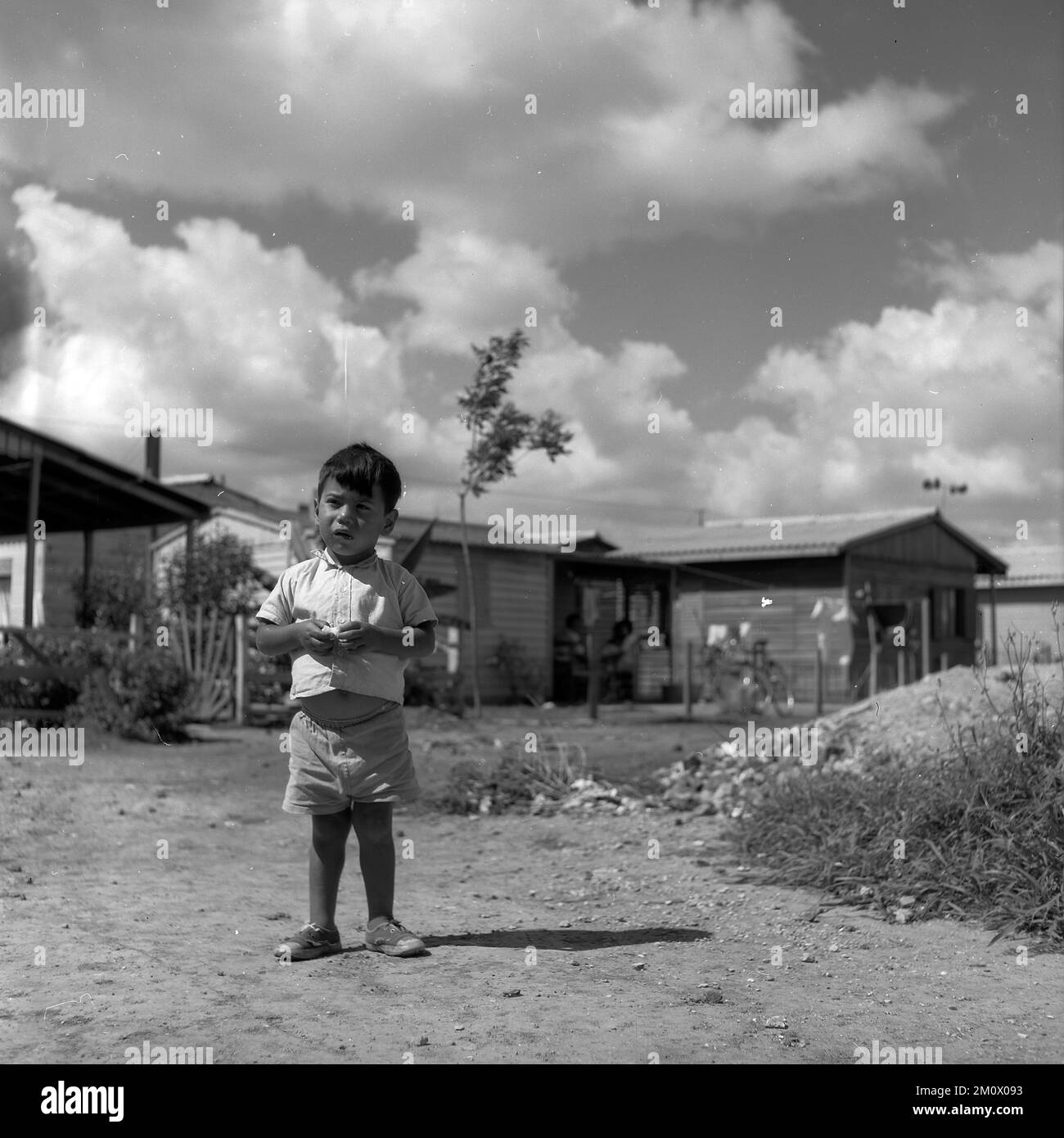 Poor children at Villa Miseria (Misery Village) at Buenos Aires outskirts, circa 1960 Stock Photo