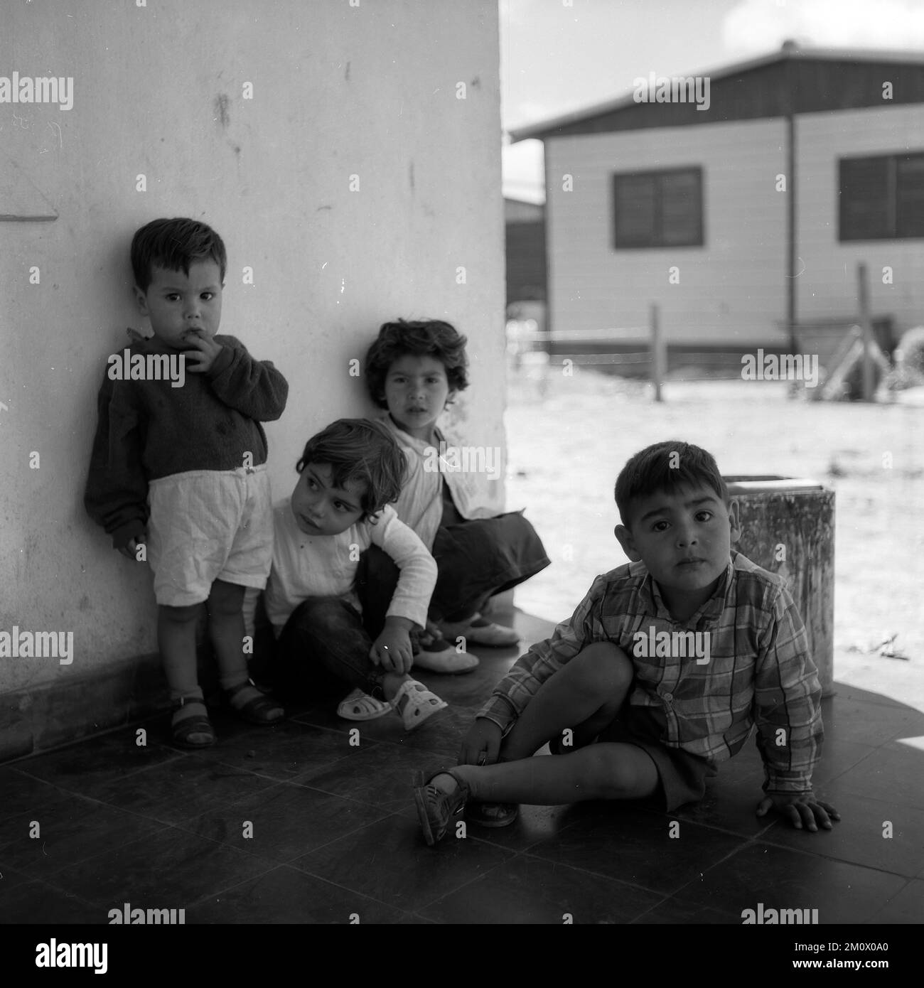 Poor children at Villa Miseria (Misery Village) at Buenos Aires outskirts, circa 1960 Stock Photo