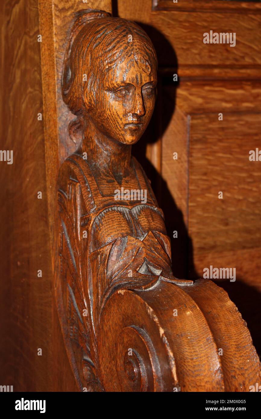 Carved Female Figure On A Choir Stall, St Hilary's Church, Wallasey, Wirral, UK Stock Photo