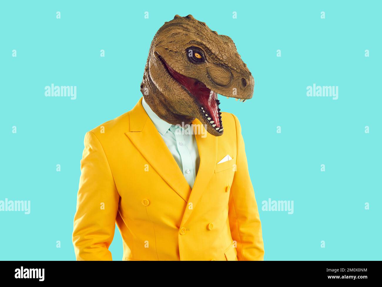 Half length portrait of eccentric man with dinosaur head mask Stock Photo