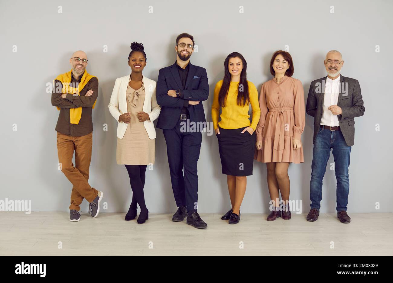 Group portrait of diverse businesspeople pose in office Stock Photo